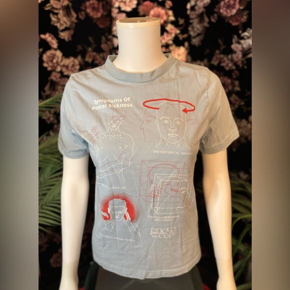 MEOW WOLF Symptoms Of Portal Sickness Baby Blue Graphic Tee Size Small - Picture 1 of 6